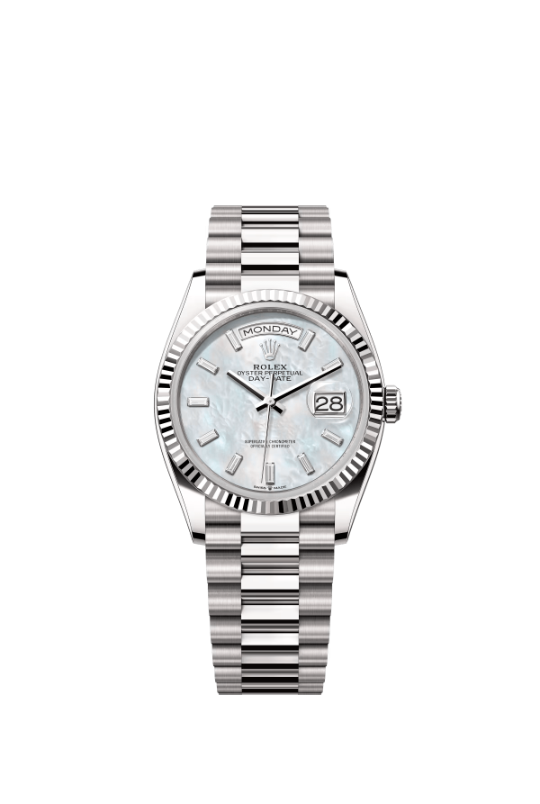 The Oyster Perpetual Day-Date 36 is available in 18 ct white yellow gold with a diamond-set white mother-of-pearl dial, fluted bezel and President bracelet. -m128239-0065